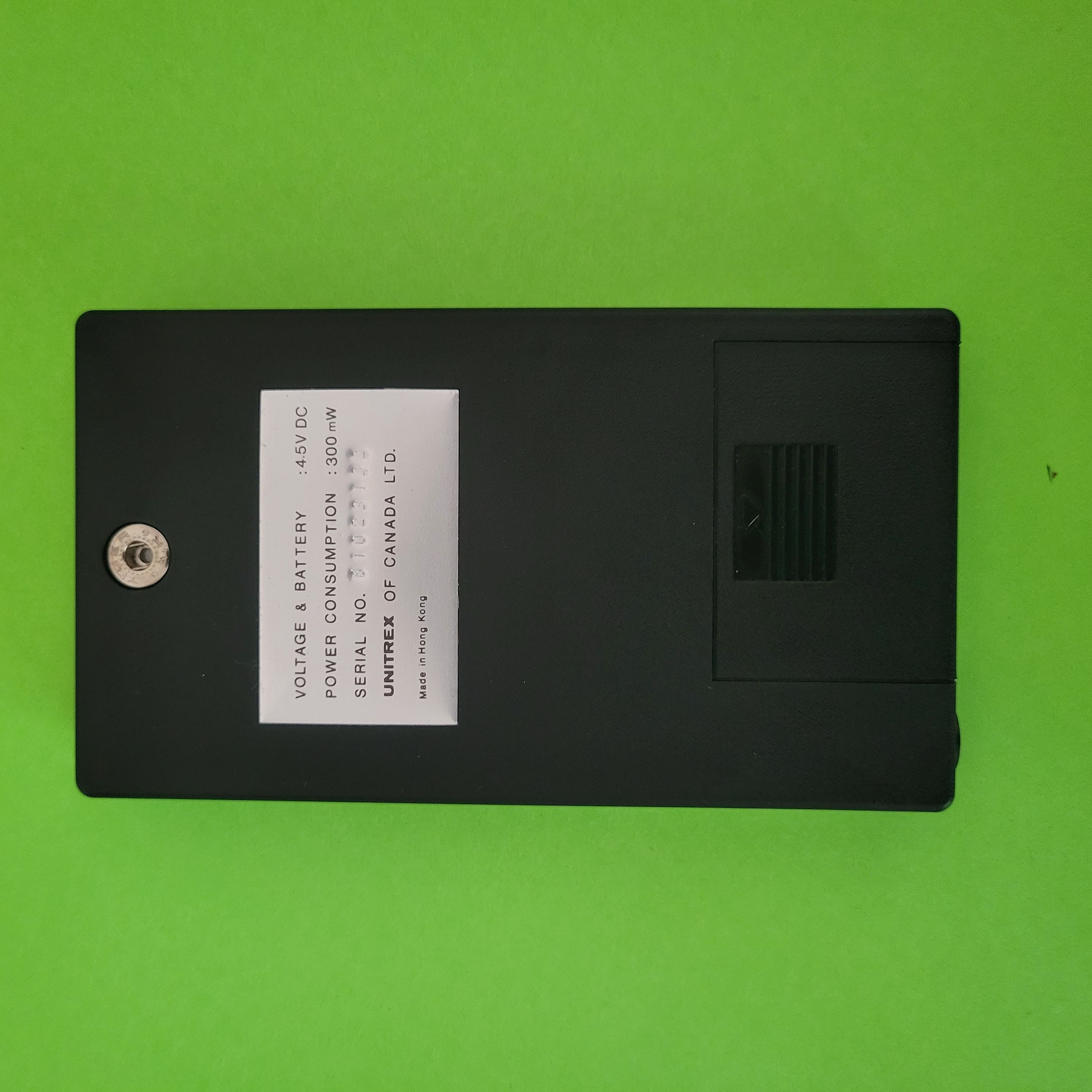 An image of the back of a Unitrex 89 SLW Four function plus calculator